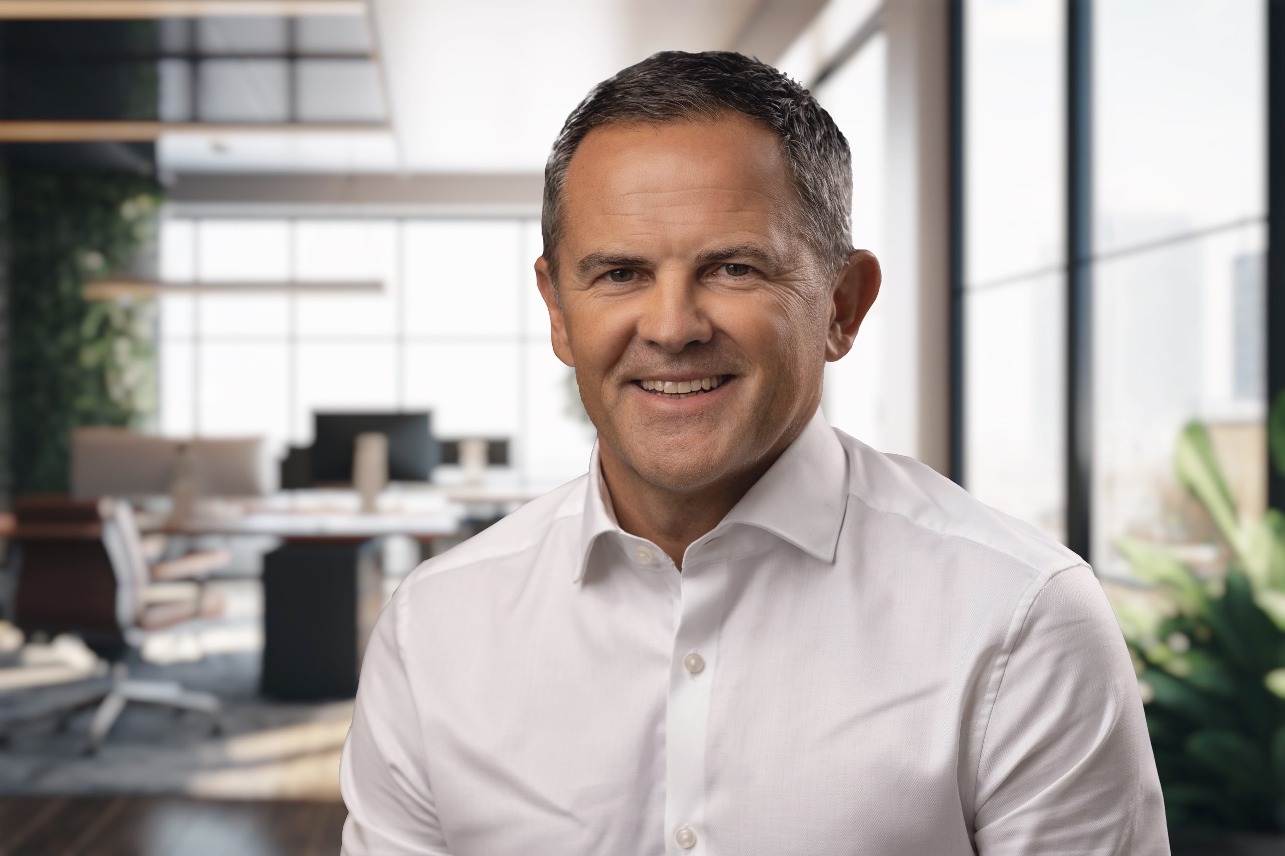 Blurred large modern office workspace in the morning , interior